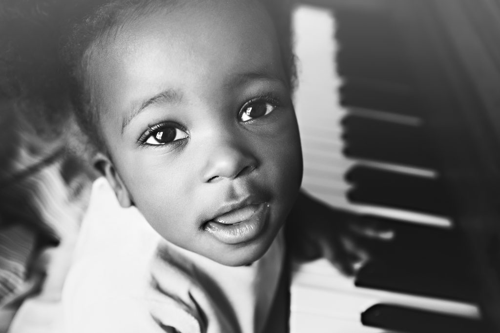 Little girl playing piano picture