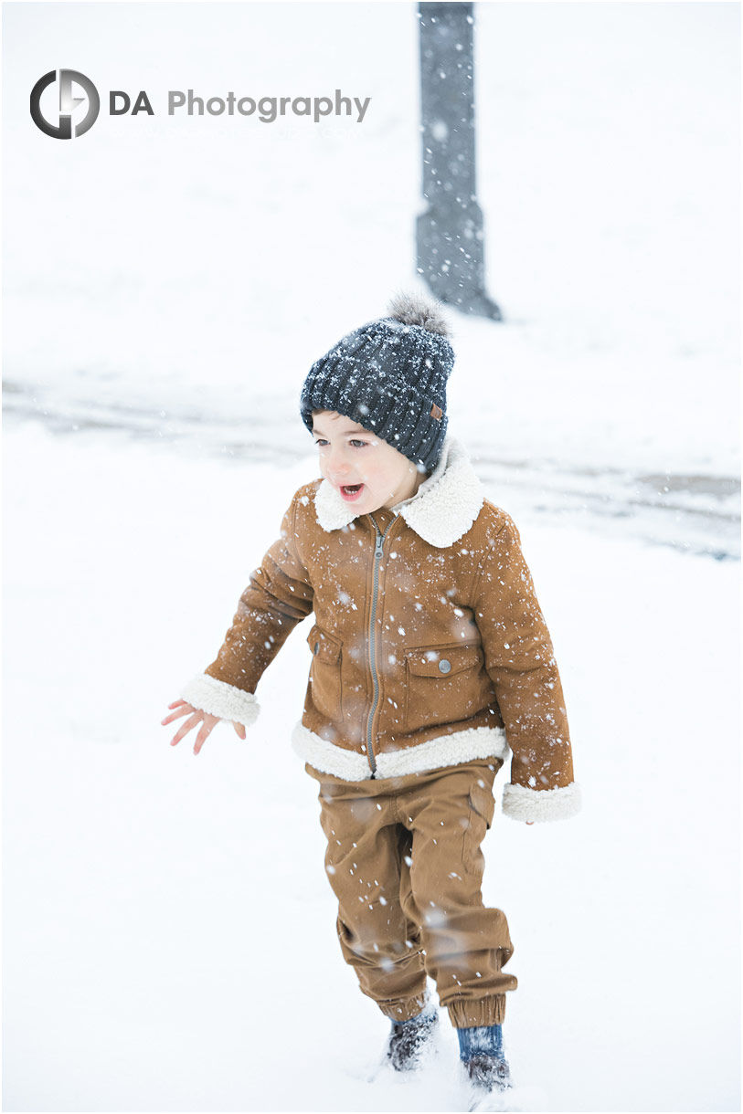 Boy playing in show Winter photos in Woodbridge